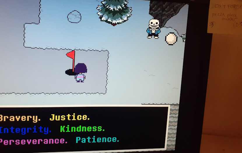 Photograph of Glenn's monitor as he CHECKs the red flag. There is a sticky note on the monitor with a pizza phone number labelled don't forget.