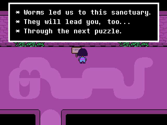 A room in the Ruins with a sign that tells you to follow a worm through the next room.